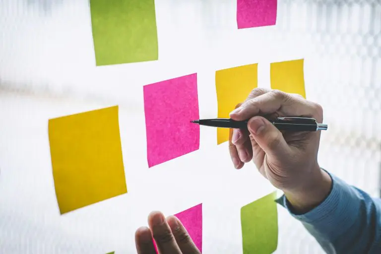 Businessman use post it notes to planning idea and business marketing strategy