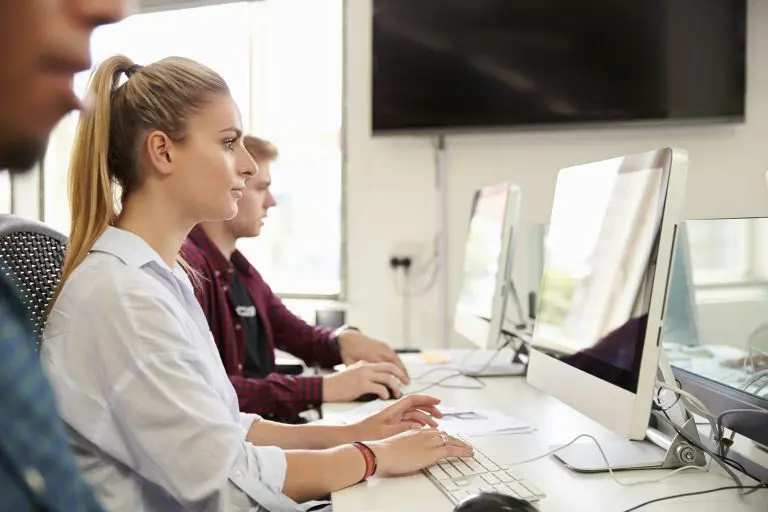 Group Of University Students Using Online Resources