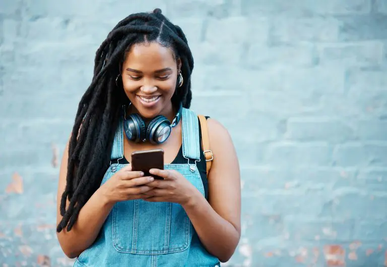 Black woman with 5g smartphone for social media typing, digital chat app or check location on blue