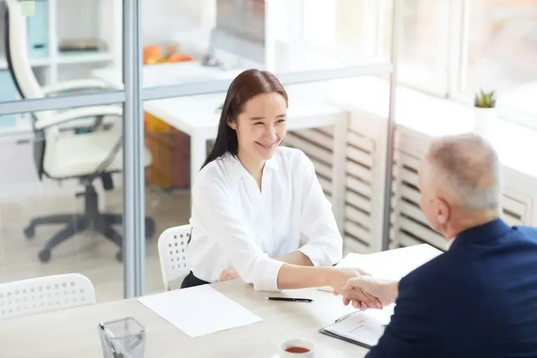 Intern Shaking Hands With Manager